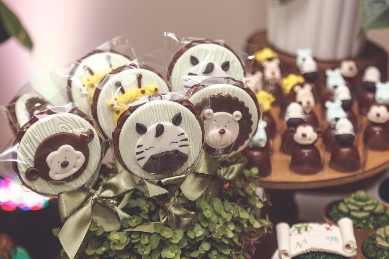 service-01 Cute chocolate lollipops with animal faces displayed elegantly for a party.