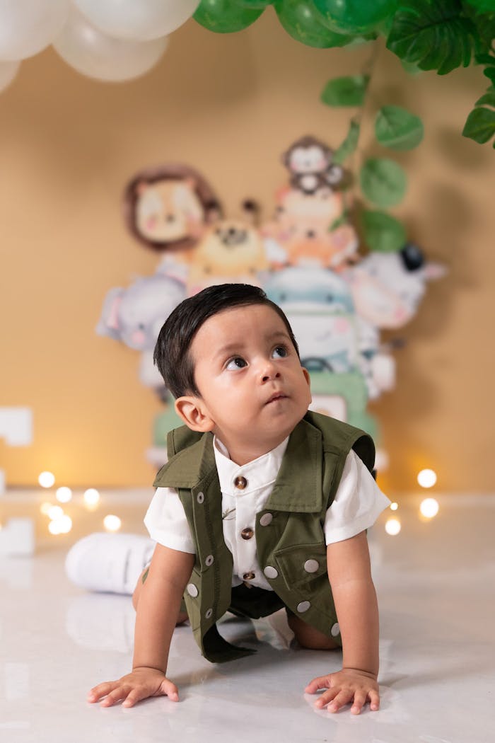 engagement-photography-04 Cute baby in jungle-themed celebration with animal decor.