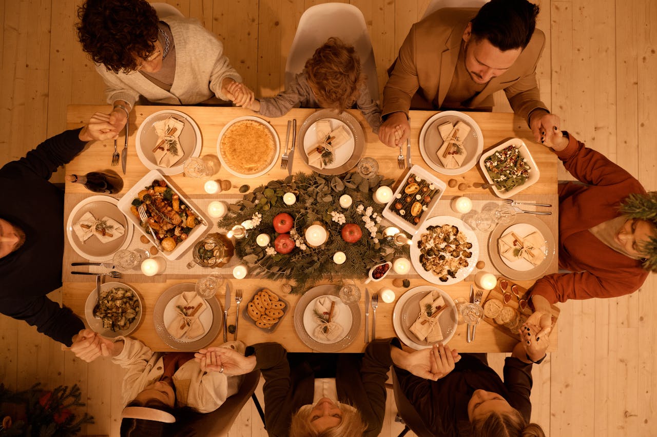 service-05 Family gathered around a beautifully set table for a festive Christmas dinner celebration.